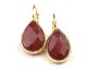 Earrings with treated rubies from India