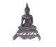 Buddha sitting on art deco pedestal