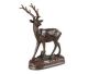 Bronze statue of a deer. Rutting deer with the nose lifted in the wind.