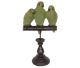 Parakeet family in natural olive-green color on their stick.