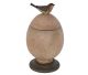 Very nice Bird seated on a huge egg which is in fact a storage box.